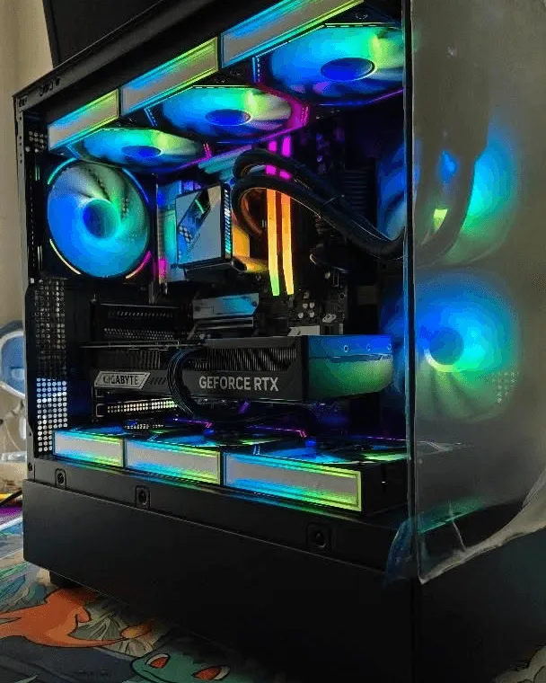 Black tower with green RGB fans and a Gigabyte RTX graphics card